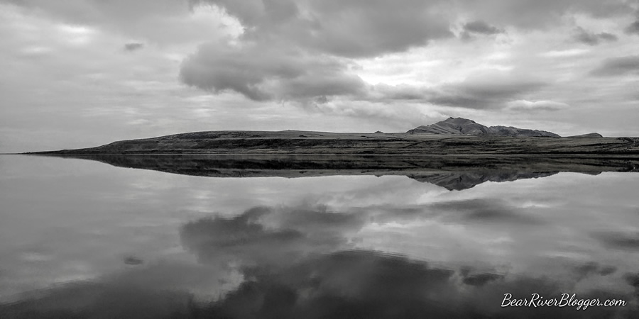 antelope island and great salt lake under a cloudy sky