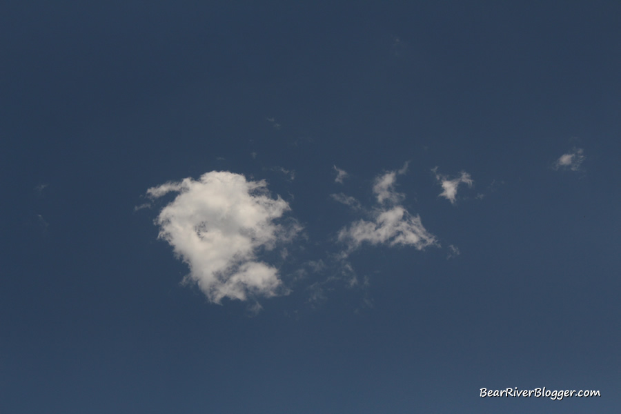 small white cloud with a blue sky background