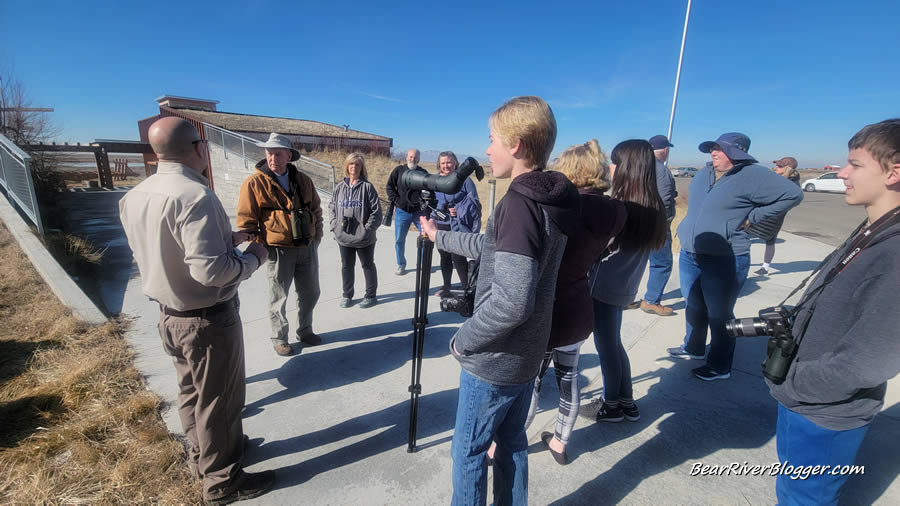 billy fenimore talking to a group of bird watchers at farmington bay