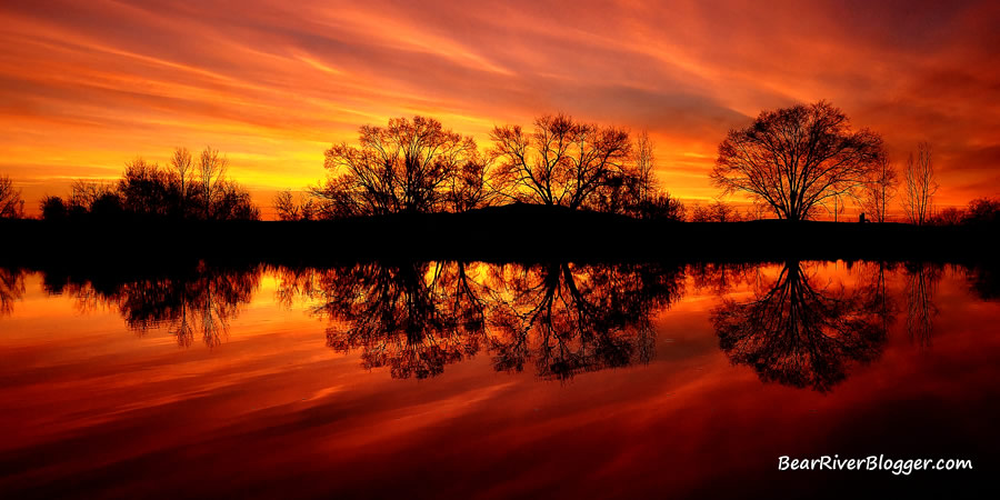 brilliantly colored sunset reflection over water