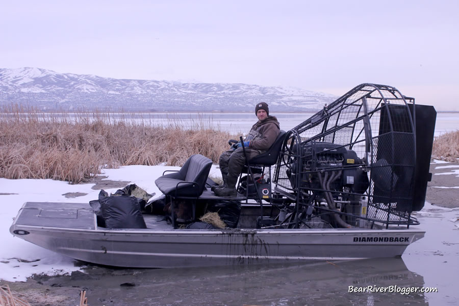 Dave England ready to drive the airboat at Farmington Bay to work on the Canada goose nesting platforms