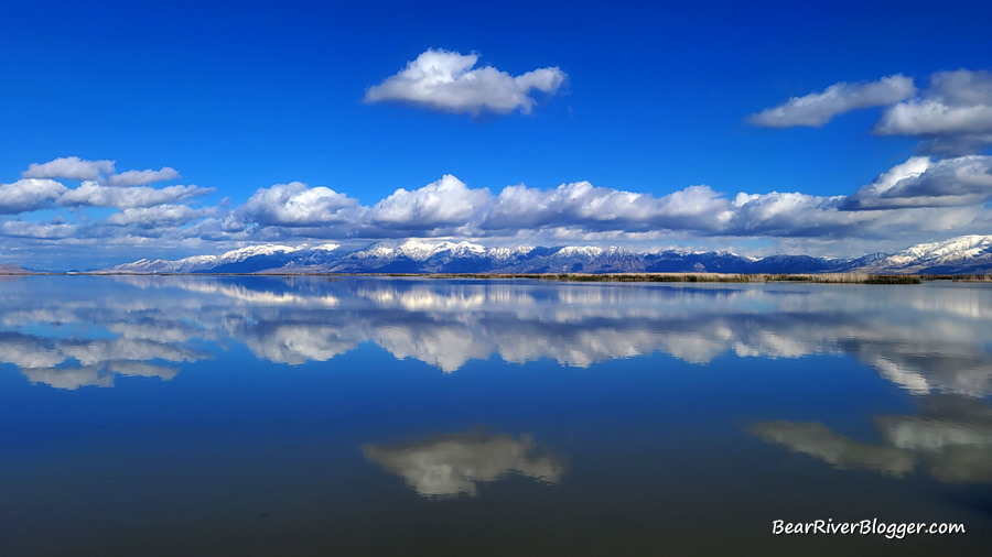 clouds reflecting on the still water on the bear river migratory bird refuge auto tour loop