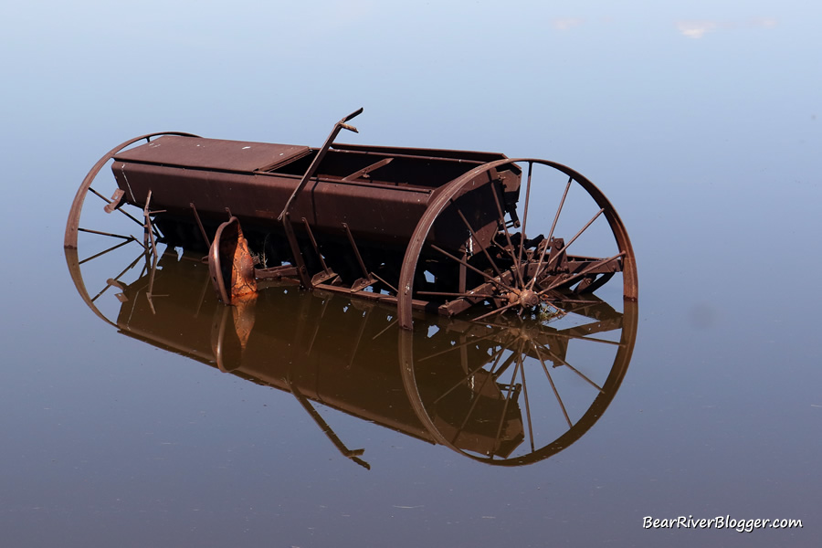 farm equipment giving a reflection in the flood waters near the bear river migratory bird refuge