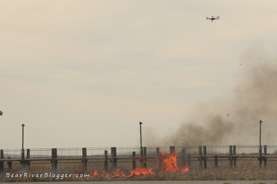 drone flying over the prescribed fire on the bear river migratory bird refuge.