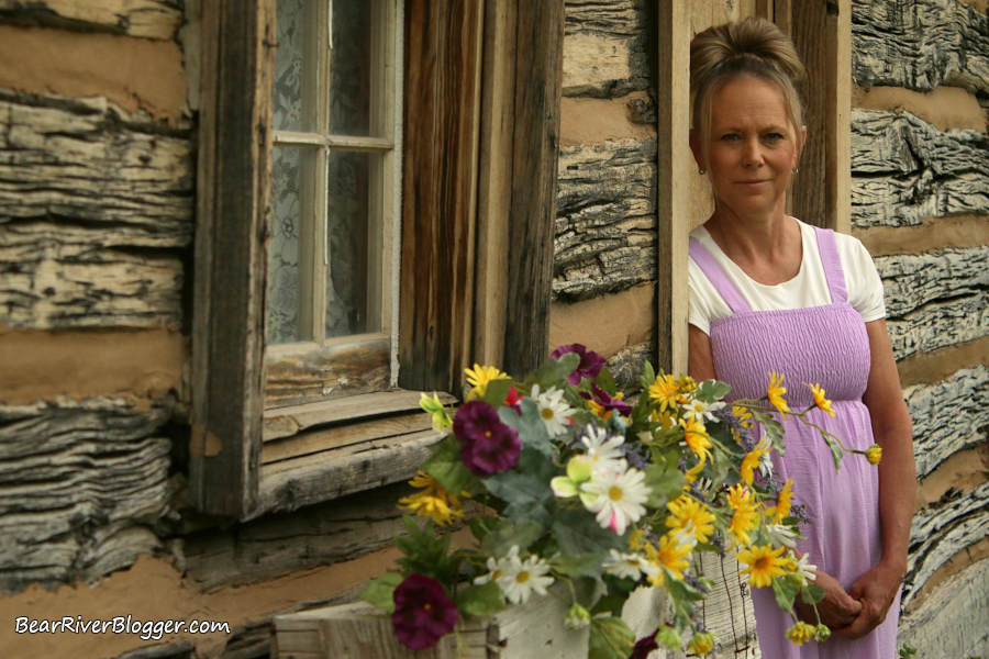 outdoor portrait photography with flowers and an old building