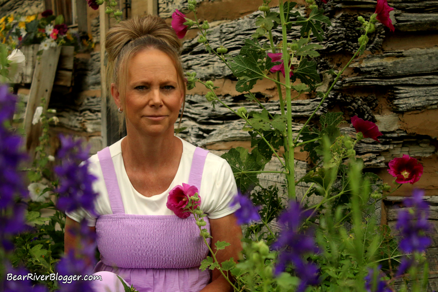 outdoor portrait photography with an old building and some colorful flowers